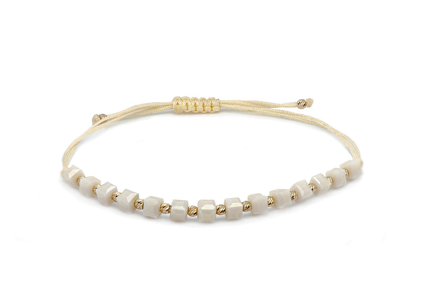 Cream thread bracelet with onyx and gold
