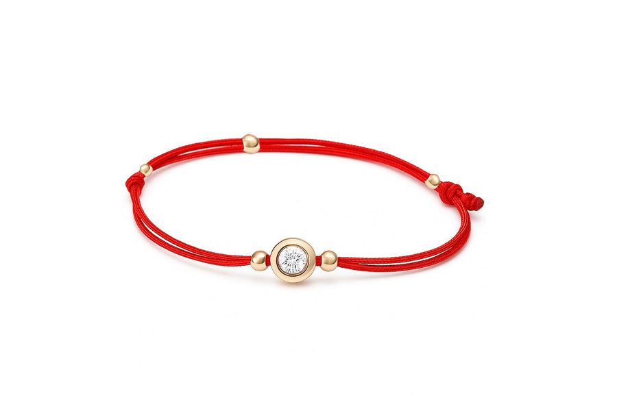 Raudono siūlo apyrankė su auksiniu cirkonio pakabuku