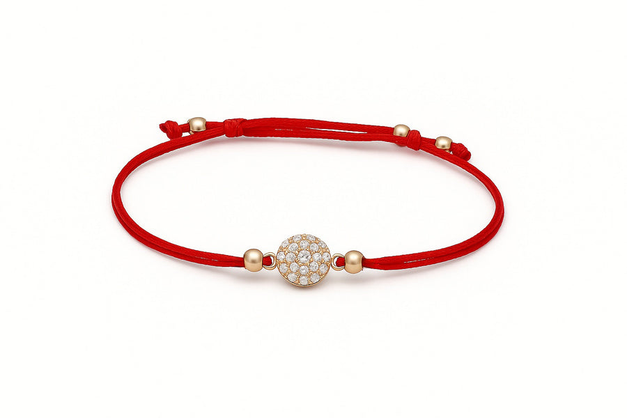 Raudono siūlo apyrankė su auksiniu cirkonio pakabuku