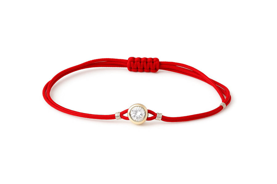 Raudono siūlo apyrankė su auksiniu cirkonio pakabuku